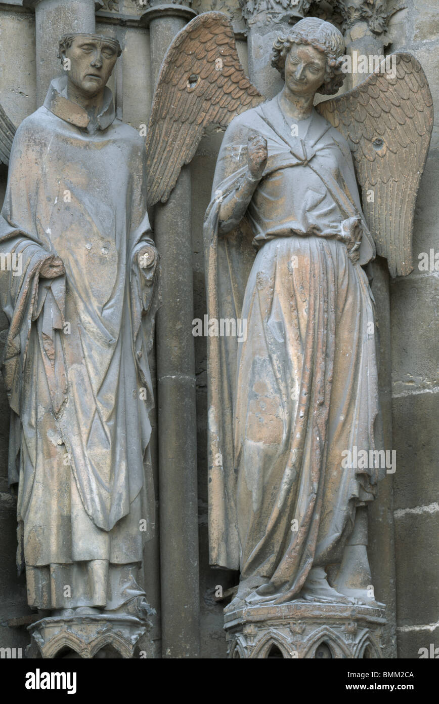Reims Cathedral, France. Gothic sculpture on west portal, south door, showing angel of the smile, with St Nicaise [SPEBMM2CA]