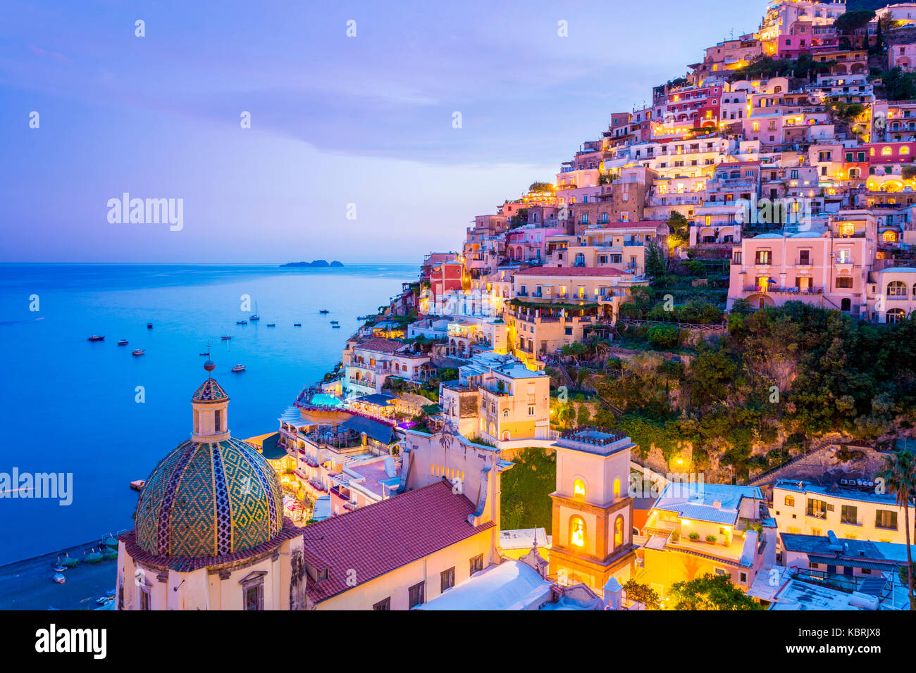 Positano, Amalfi Coast, Campania, Sorrento, Italy. View of the town and the seaside in a summer sunset [SPEKBRJX8]