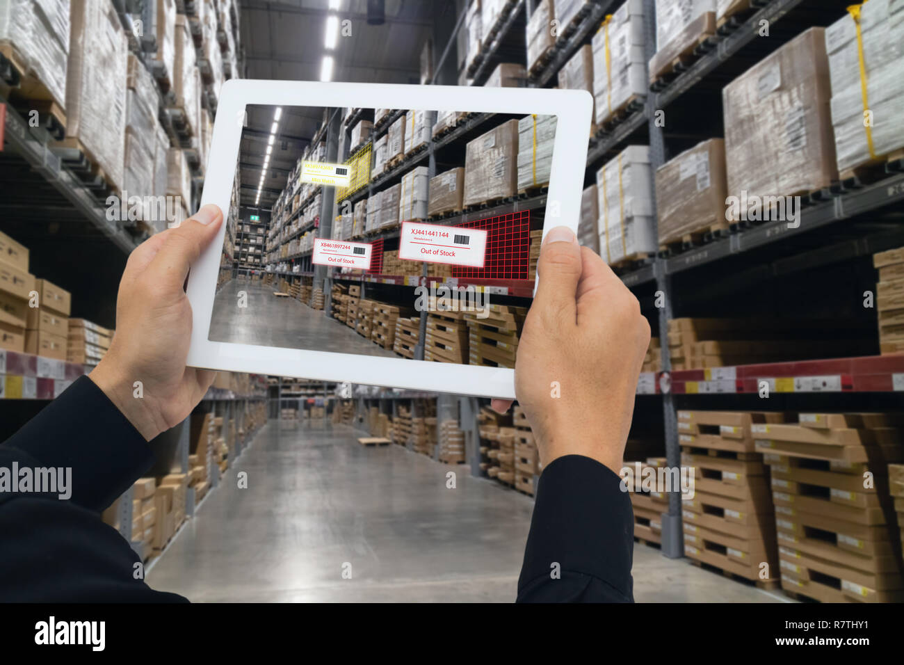 iot smart retail in the futuristic concept, the retailer hold the tablet and use augmented reality technology monitor data of out of shelve, price, pl [SPER7THY1]
