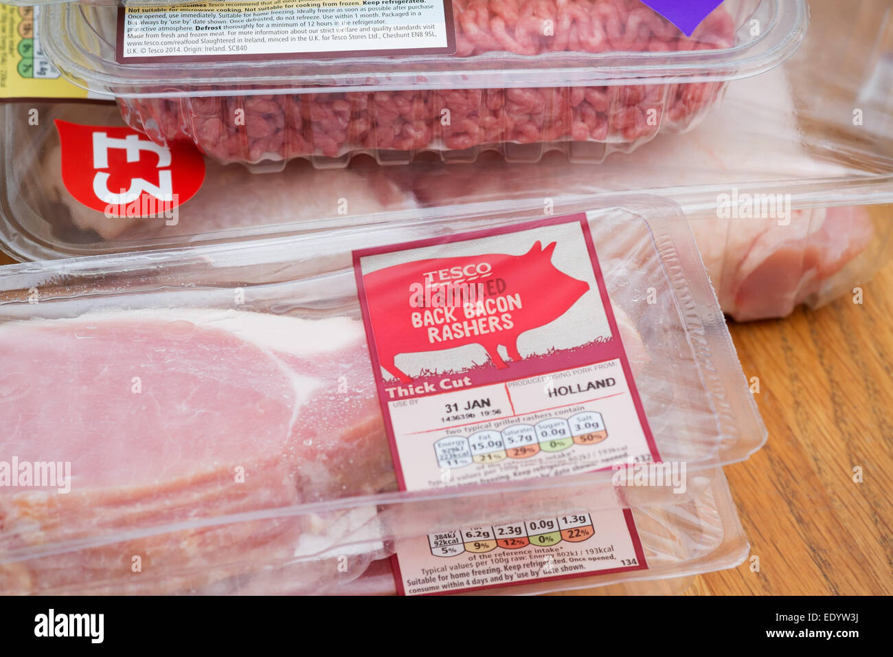 The weekly food shop: own brand packaged meat items purchased at Tesco supermarket - beef mince and bacon Stock Photo